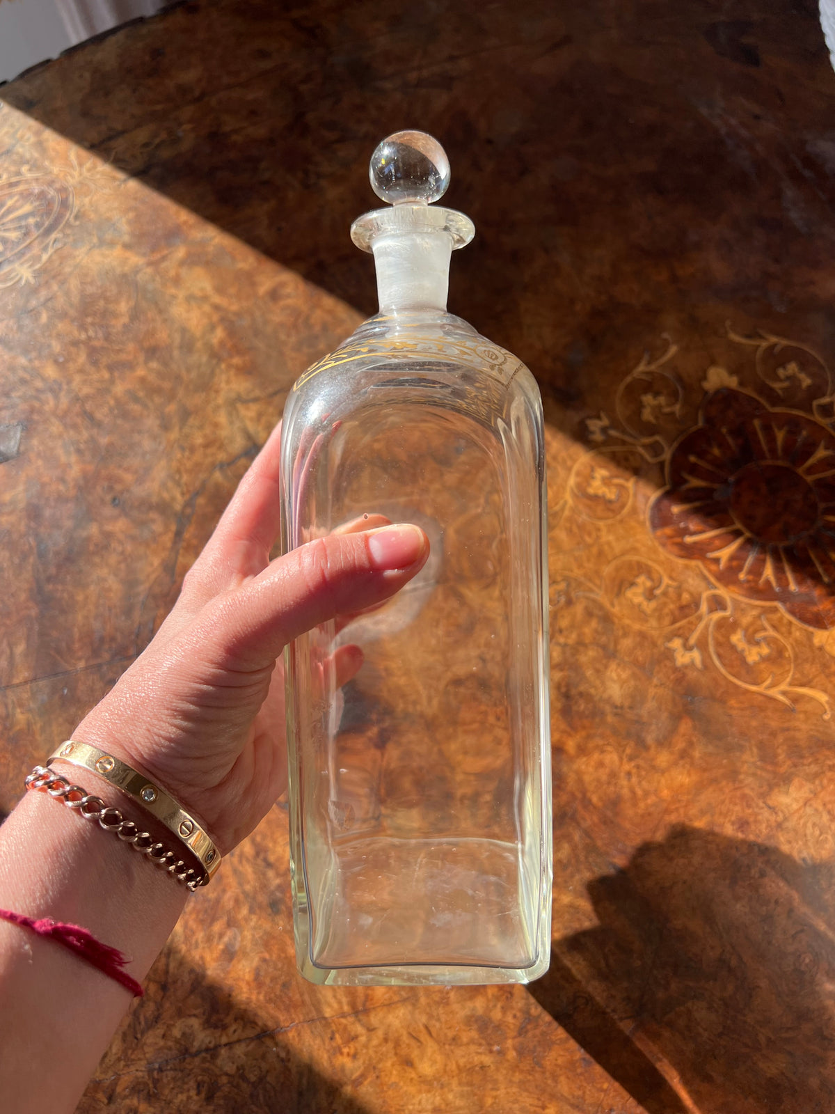 Neoclassical spirit decanter or liqueur bottle with gilt floral motif